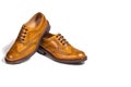Male Footwear. A Pair of Full Broggued Tan Leather Oxfords Shoes