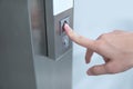 Male forefinger pressing on button up elevator Royalty Free Stock Photo