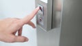Male forefinger pressing on button up elevator Royalty Free Stock Photo