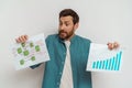 Male freelancer or salesman showing his charts sales and business plan on white background Royalty Free Stock Photo