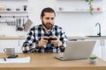 Male freelancer taking break and plays video games after work. Royalty Free Stock Photo