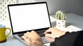Male freelancer using laptop at home office. Blank screen for your graphic display montage. Royalty Free Stock Photo