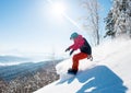 Shot of a freeride snowboarder riding in the mountains wearing snowboarding gear