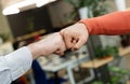 Male friends greeting each other with fist bump Royalty Free Stock Photo