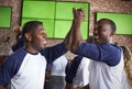 Male Friends Watching Game In Sports Bar Celebrating Royalty Free Stock Photo