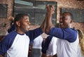 Male Friends Watching Game In Sports Bar Celebrating Royalty Free Stock Photo