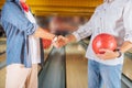 Close up of a handshake in a bowling club