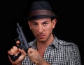 Male gangster loading gun Royalty Free Stock Photo