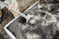 Male gardener worker digging in vegetable garden with shovel. Farmer man in rubber boots working hands with spade dig black soil, Royalty Free Stock Photo