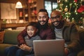 male gay couple family with a child smiling in the living room having a good time the three together sitting on the couch sofa, Royalty Free Stock Photo