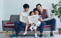 Male gay taking care adopted children who are diverse little Caucasian girl and African boy, kissing, drawing family picture, Royalty Free Stock Photo