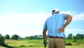 Male golf player feeling strong lower back pain after ball hitting, trauma Royalty Free Stock Photo