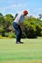 Male golf player on professional golf course.