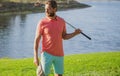 Male golf player on professional golf course. Portrait of golfer man with golf club. Royalty Free Stock Photo