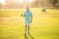 male golf player on professional course walk on green grass, golfing Royalty Free Stock Photo