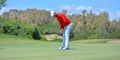 Male golf player on professional golf course. Royalty Free Stock Photo