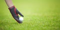 Male golf player teeing off golf ball Royalty Free Stock Photo