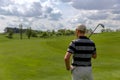 Man golfer standing at fairway on golf course Royalty Free Stock Photo