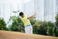 Male golfer hitting golf ball out of a sand trap Royalty Free Stock Photo