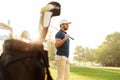 Male golfer holding driver while standing Royalty Free Stock Photo