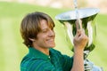 Male Golfer Holding His Winning Trophy