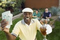 Male Golfer Holding Money And Drink