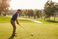 Male Golfer Lining Up Tee Shot On Golf Course Royalty Free Stock Photo