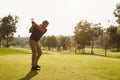 Male Golfer Lining Up Tee Shot On Golf Course Royalty Free Stock Photo