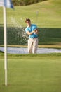 Male Golfer Playing Bunker Shot Royalty Free Stock Photo