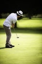 Male golfer putting Royalty Free Stock Photo