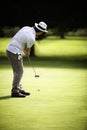 Male golfer putting