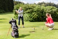 Male golfer putting golf ball on the green golf Royalty Free Stock Photo