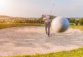 Male golfer shoting golf ball from sand bunker Royalty Free Stock Photo