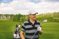 Male golfer standing at fairway on golf course Royalty Free Stock Photo