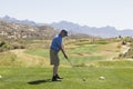 Male golfer at tee off Royalty Free Stock Photo