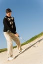 Male Golfer About To Hit Ball Royalty Free Stock Photo