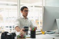 Male graphic designer working on computer at desk Royalty Free Stock Photo