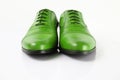 Male green leather elegant shoes on white background. Royalty Free Stock Photo