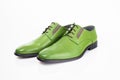 Male green leather elegant shoes on white background. Royalty Free Stock Photo