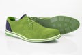 Male green leather elegant shoes on white background. Royalty Free Stock Photo