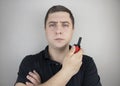 A male guard talking on a walkie talkie with his partner. A policeman takes up the challenge of public safety. Safety and Security