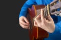 Male guitarist hands with nails while playing music. classical guitar Royalty Free Stock Photo