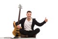 Male guitarist showing thumb up Royalty Free Stock Photo