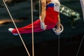 male gymnast exercise l-sit position on ring frame competition artistic gymnastics