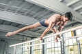 Male gymnast performing handstand on parallel bars Royalty Free Stock Photo