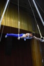 Male gymnast performing on stationary gymnastic rings Royalty Free Stock Photo