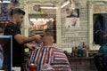 Male Hairdresser Styling a Clients Hair.