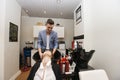 Male hairstylist washing female customer's hair in beauty salon Royalty Free Stock Photo