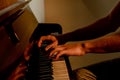 Male hairy hands, guy playing piano, fingers close up, horizontal image Royalty Free Stock Photo