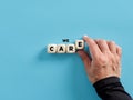 Male hand arranging wooden cubes with the word we care. Giving care, support, assistance, help and providing the needs Royalty Free Stock Photo